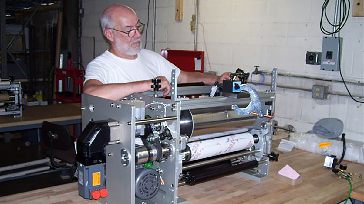 Print technician servicing a flexographic printer